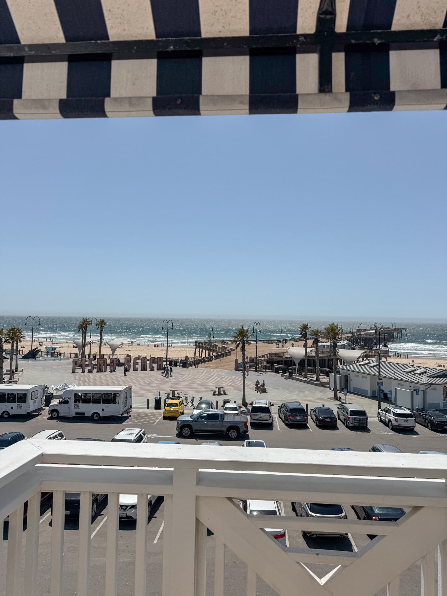 The view from our balcony at Inn at the Pier, looking over the Pismo Beach sign toward the pier, the beach and the ocean