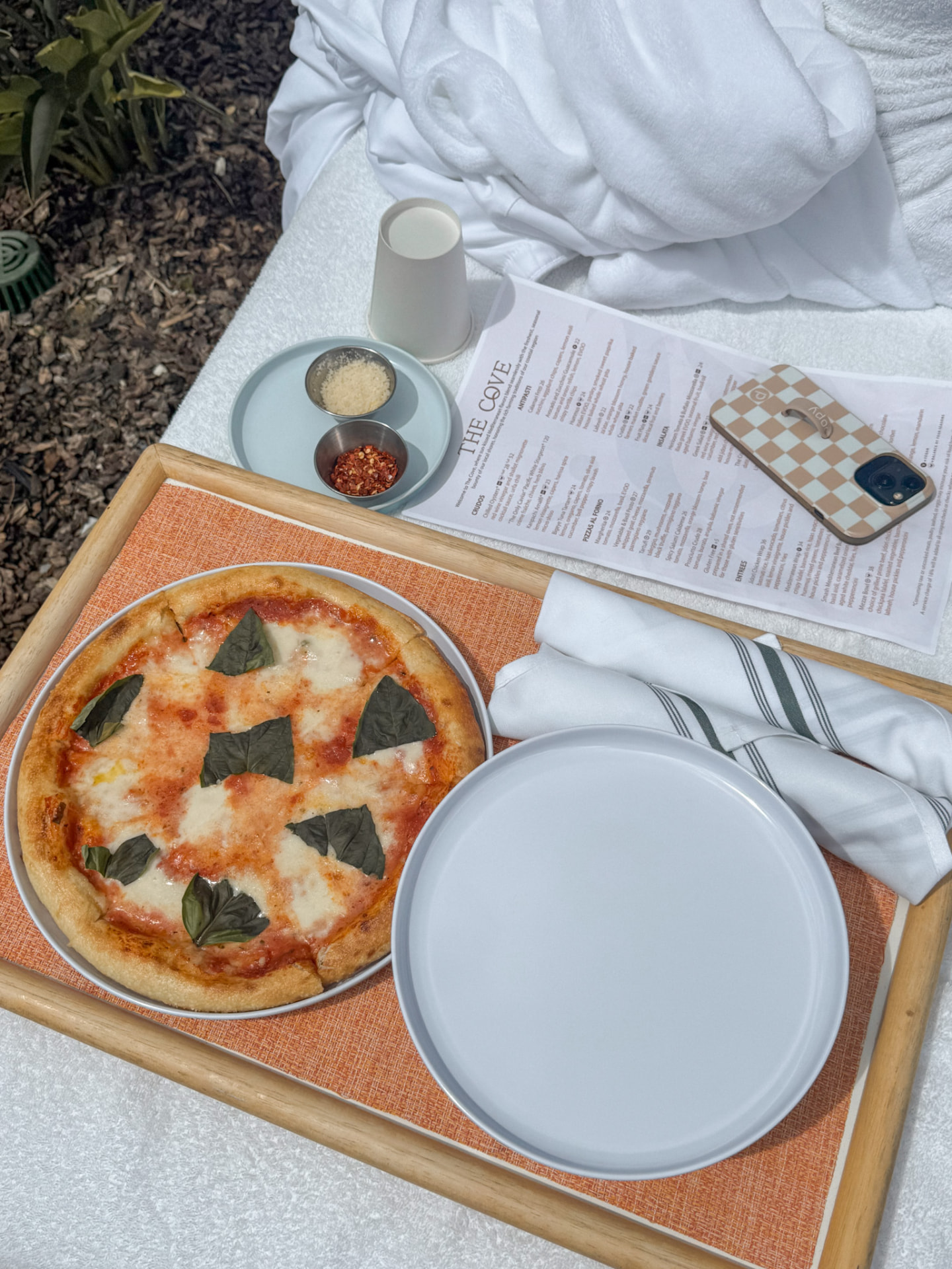 Poolside pizza served on a resort afternoon