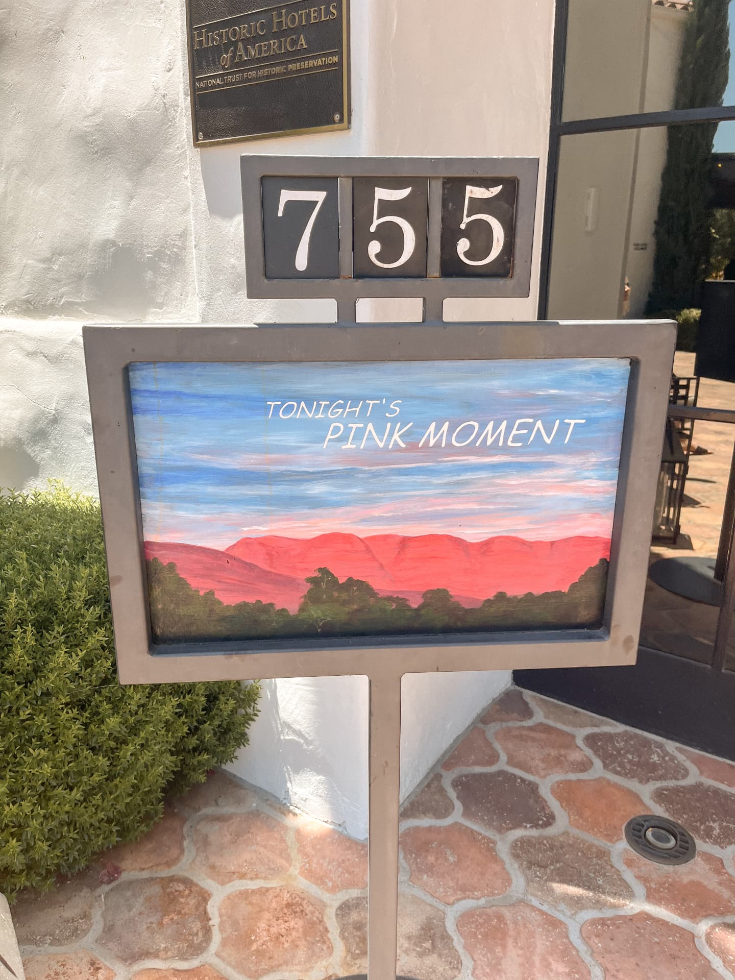 A hand-painted sign at Ojai Valley Inn announcing tonight's Pink Moment, showing the Topatopa mountains glowing pink
